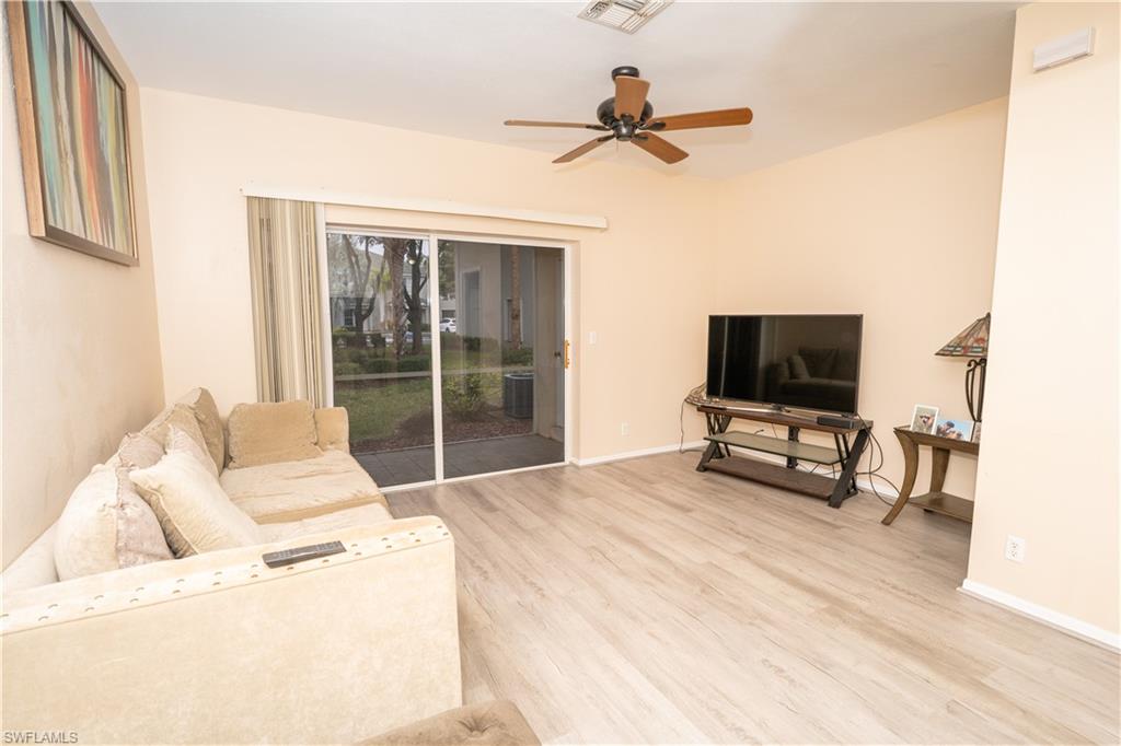 Living room featuring light wood-style floors and ceiling fan