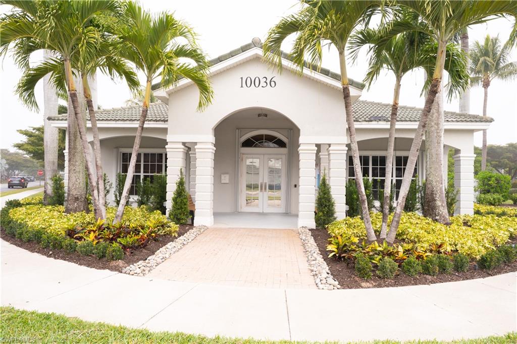 Property entrance with french doors, stucco siding, and a tiled roof