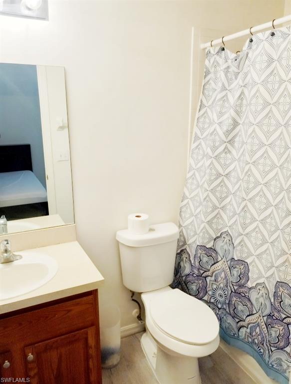 Ensuite bathroom featuring vanity and curtained shower