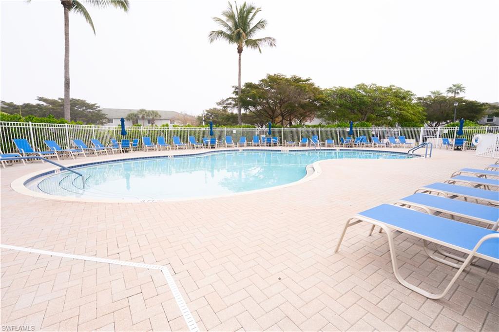 Community pool with a patio area