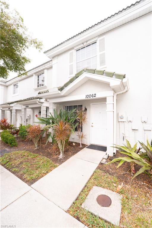 View of exterior entry with stucco siding