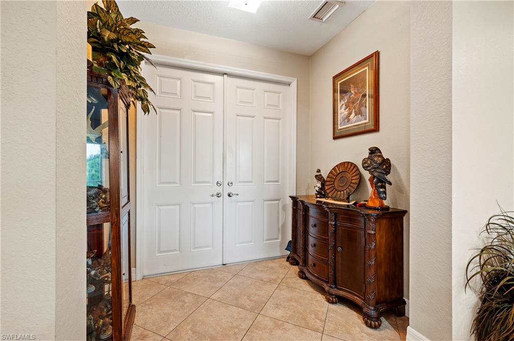 Entrance foyer with light tile patterned floors