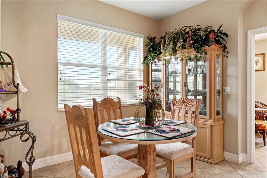 Dining area with light tile patterned floors