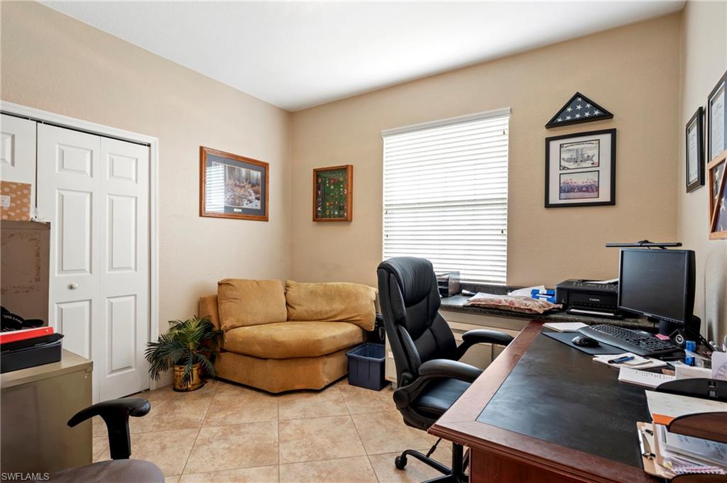 Office space featuring light tile patterned floors