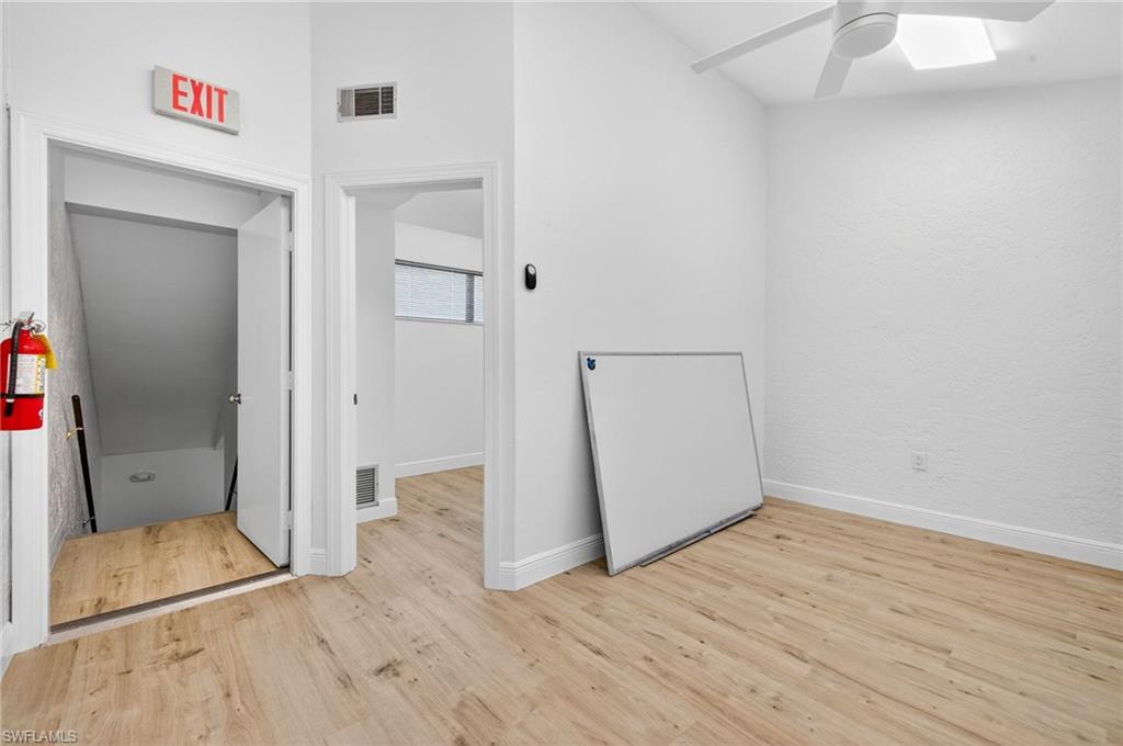 Unfurnished bedroom featuring light wood finished floors and a ceiling fan