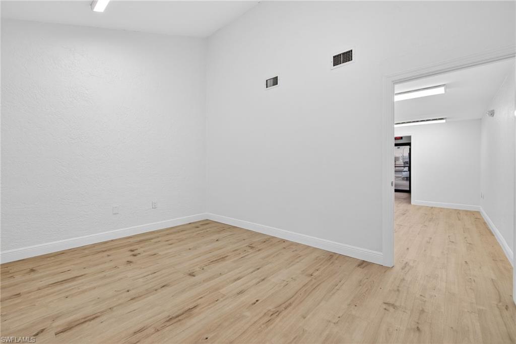 Spare room with light wood finished floors and baseboards