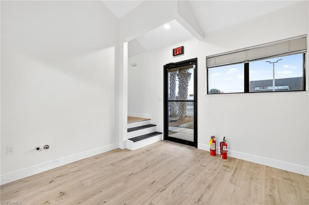 Empty room with light wood-style flooring and baseboards