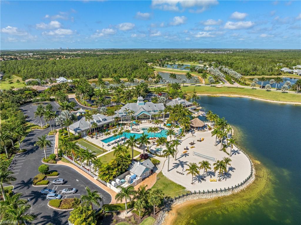 Bird's eye view of a heavily wooded area and a nearby body of water
