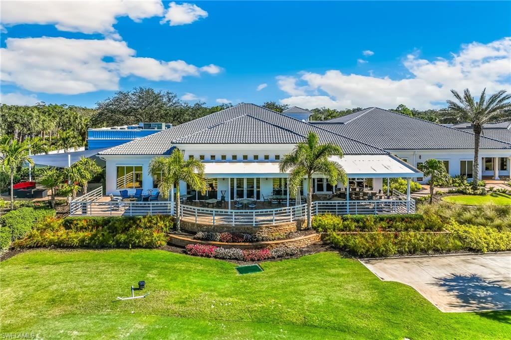 Rear view of property with a tile roof