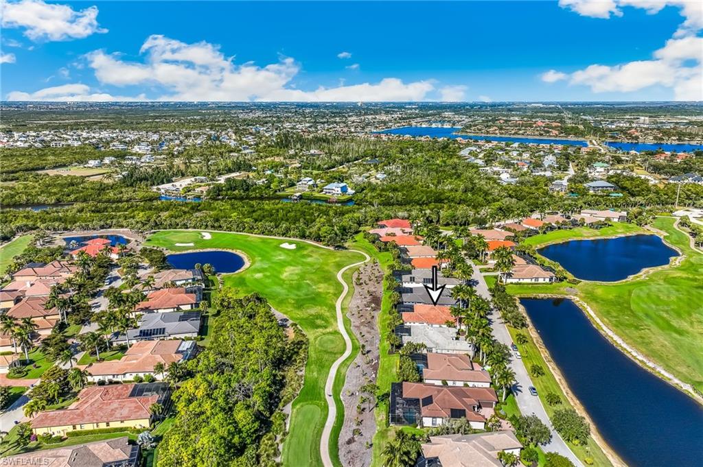 Aerial view of property's location featuring nearby suburban area