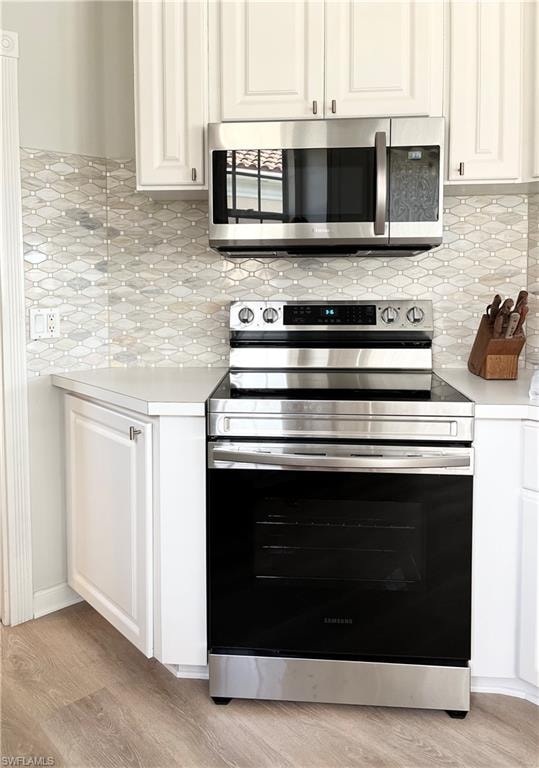Kitchen stainless steel appliances and new backsplash