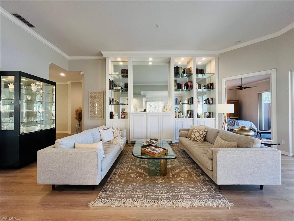 Living room featuring built-in feature wall