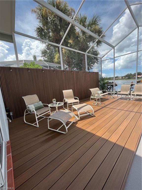 Engineered slatted wood privacy wall w/string lights and raised deck
