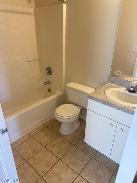 Full bath featuring vanity, light tile patterned floors, and shower / bathtub combination