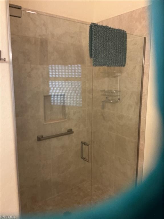 Full bathroom with a shower stall