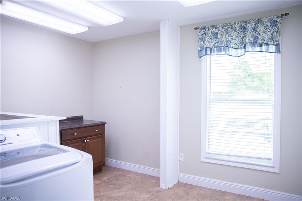 Washroom featuring washer / clothes dryer
