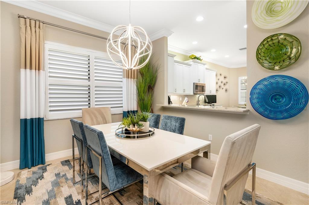 Dining room featuring crown molding, a chandelier, and recessed lighting