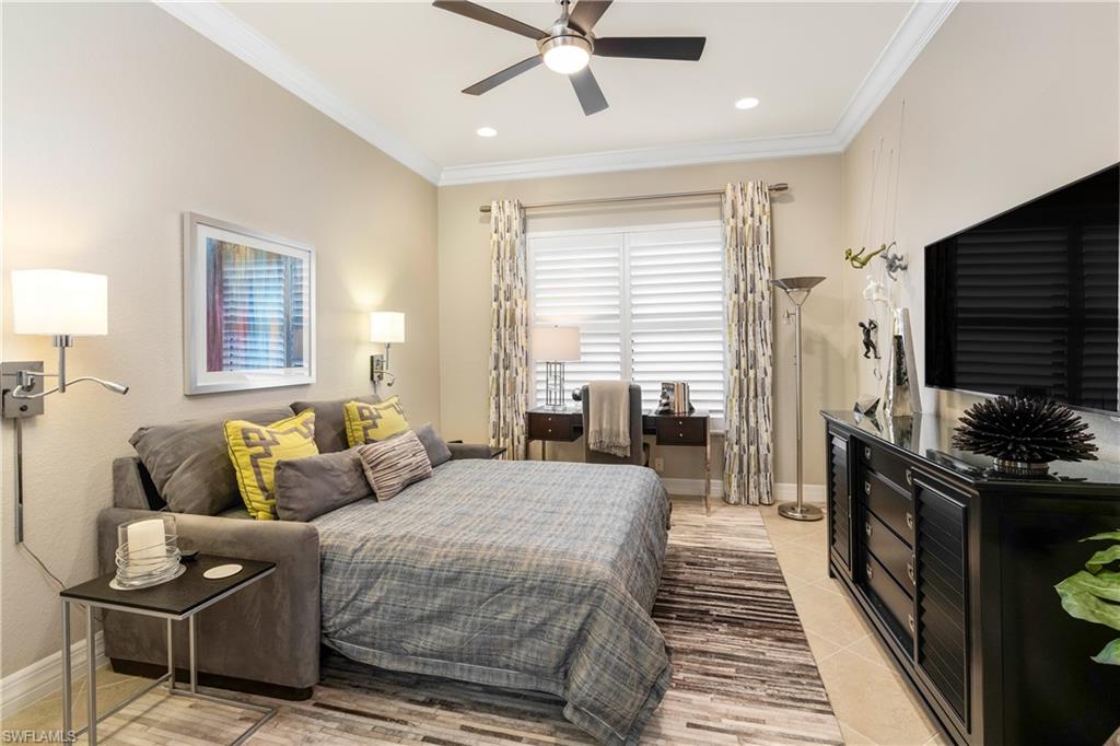 Bedroom with crown molding and ceiling fan