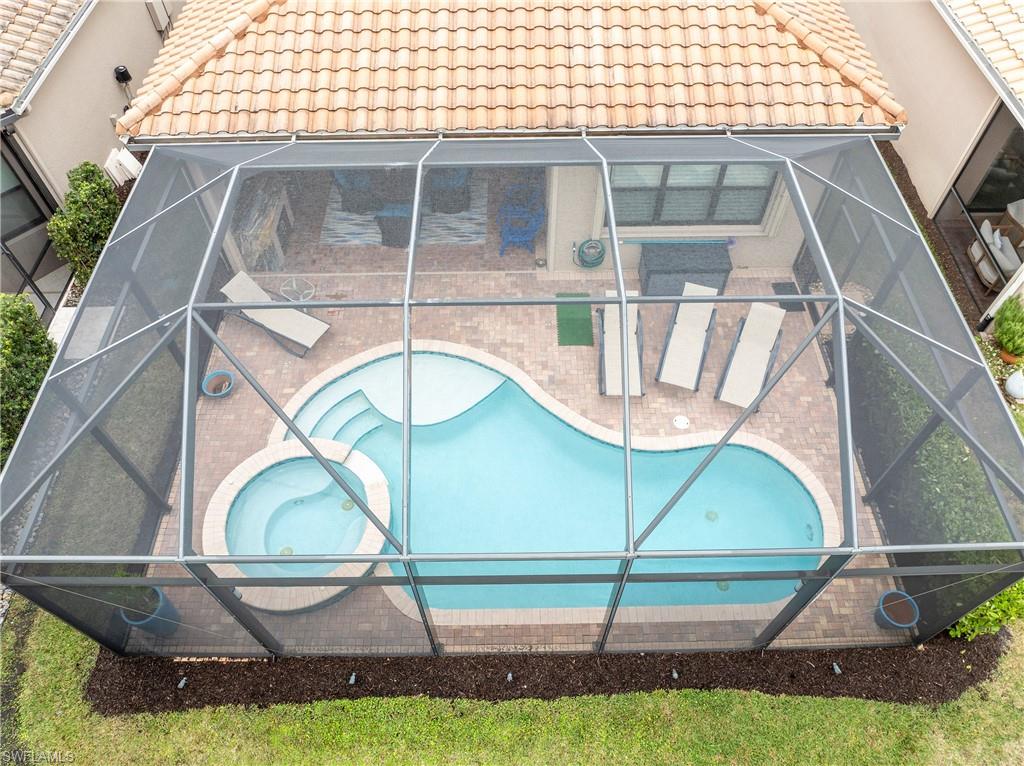 Swimming pool with a sunroom and a lanai