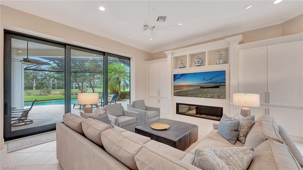 Family Room with Fireplace and sliders that open to the screened lanai