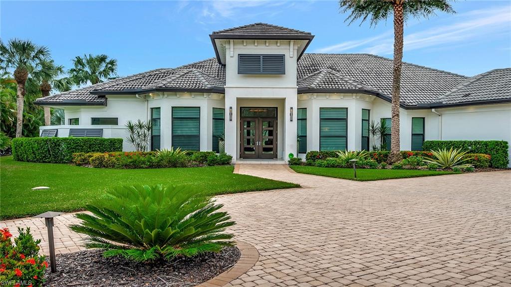 Exterior with circular driveway and two car garage
