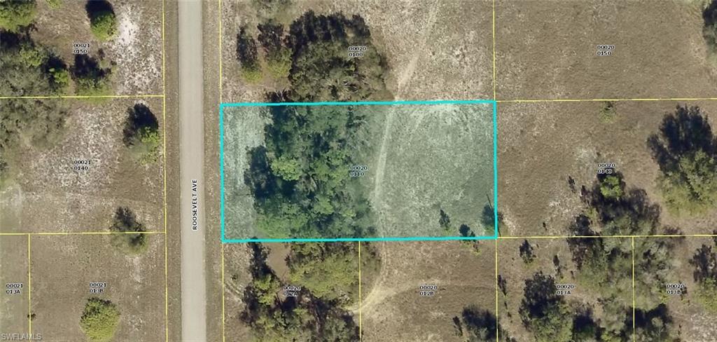 Aerial map of property and surrounding area featuring property boundaries highlighted