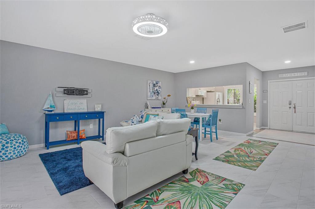 Living room featuring baseboards and recessed lighting