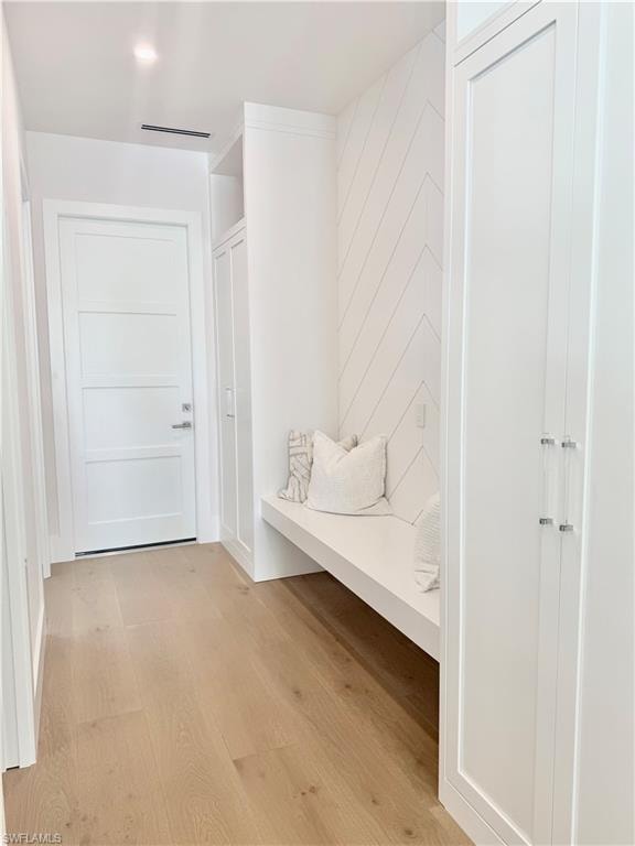 Mudroom featuring light wood-style flooring