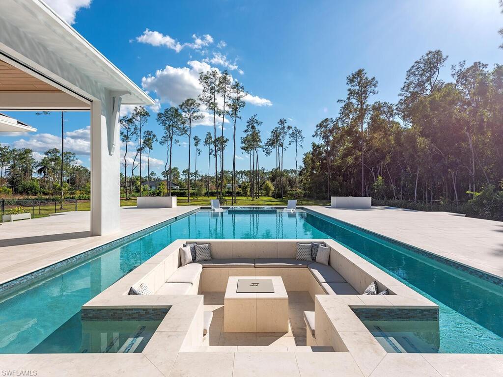 Pool with Sunken fire pit and infinity edge spa