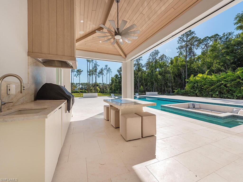 Outdoor pool featuring area for grilling, and a Hibachi Table