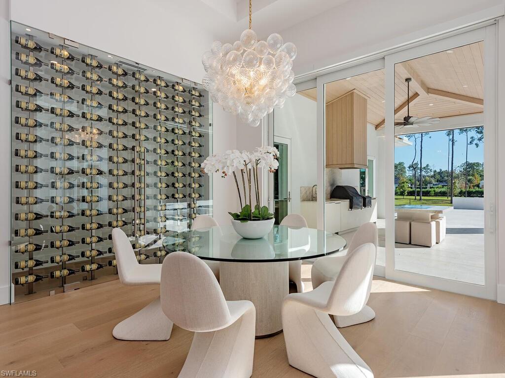Dining room featuring a chandelier and wine display