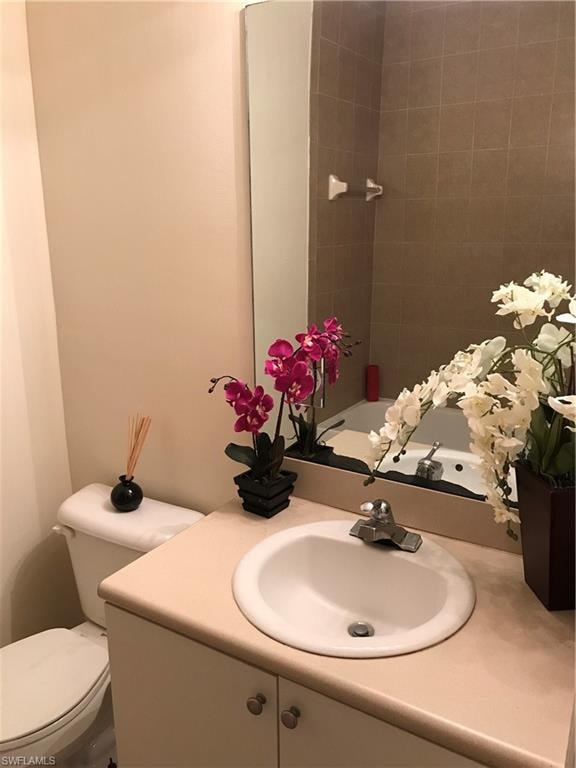 Bathroom with vanity and  shower combination