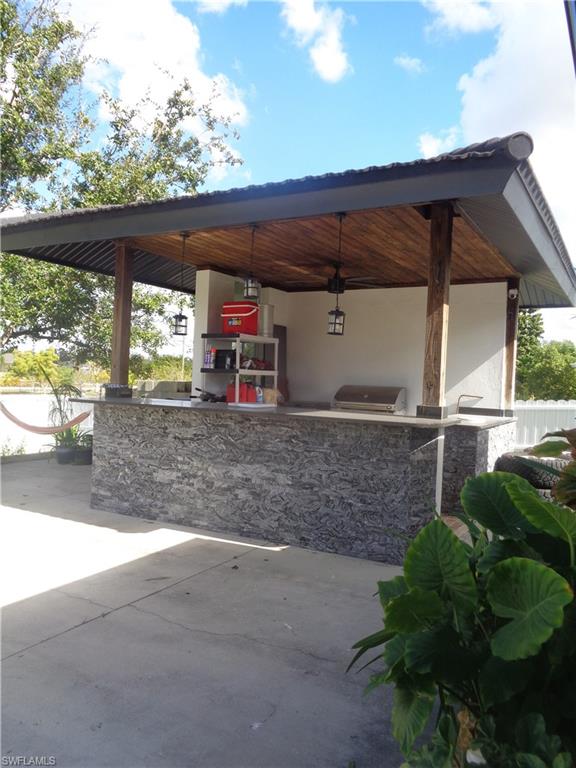 View of gazebo / terrace with a grill
