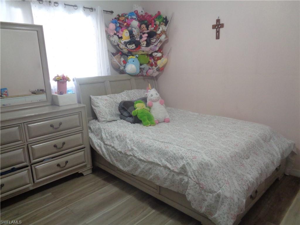 Bedroom 2 with wood finished floors