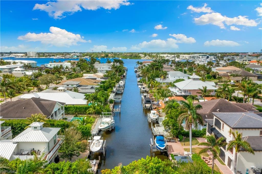 Aerial perspective of suburban area with a nearby body of water