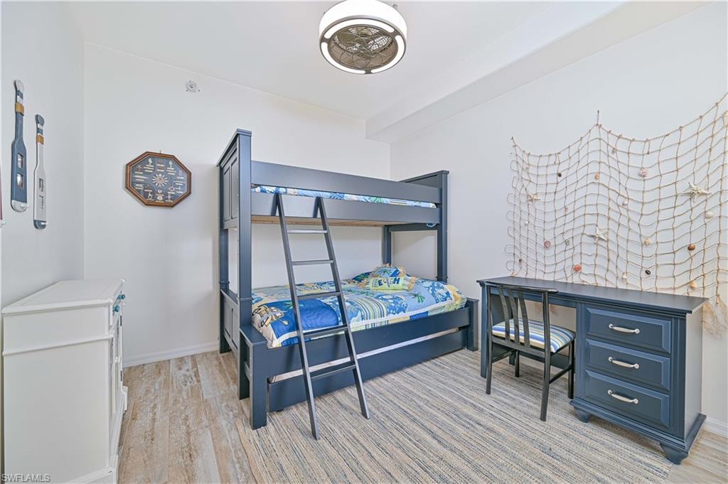 Bedroom featuring light wood finished floors and baseboards