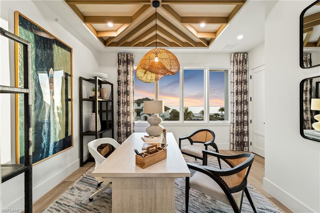 Office area with coffered ceiling, beamed ceiling, light wood-style flooring, and recessed lighting