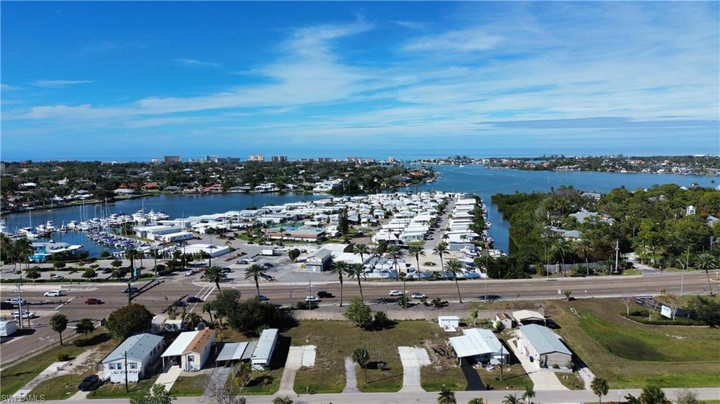 Aerial overview of property's location with a large body of water and numerous boat docks