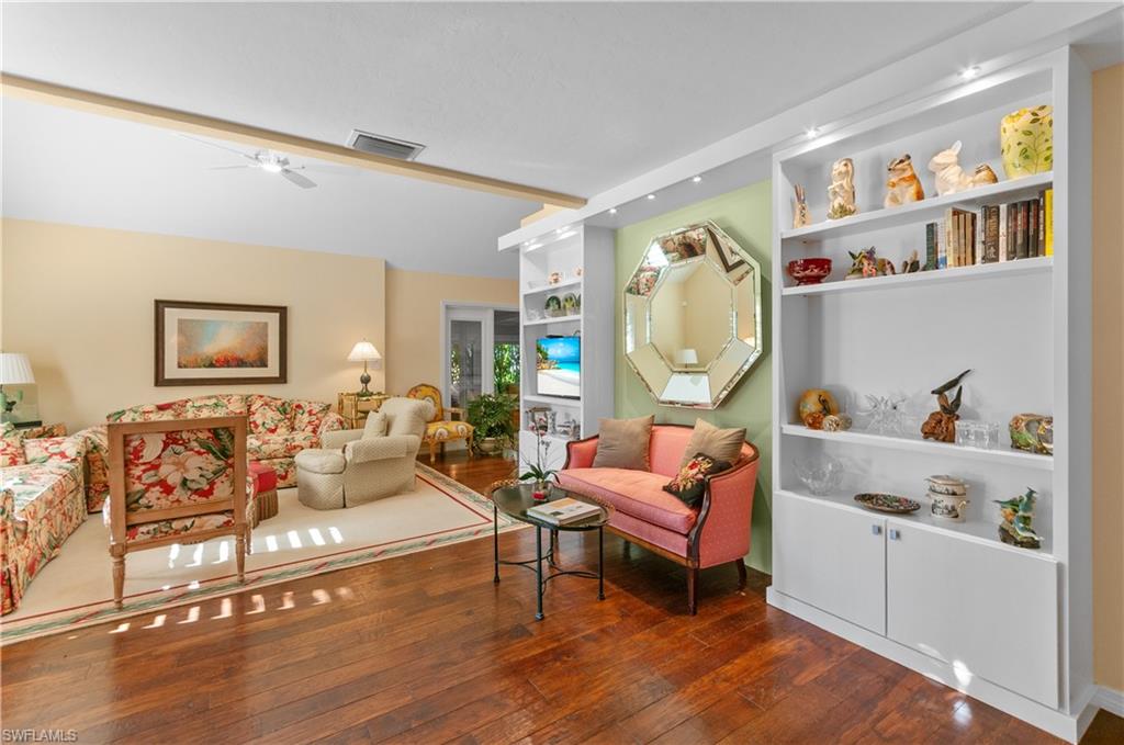Living room featuring hardwood floors, with comfy furnishing