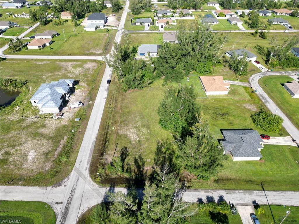 Aerial overview of property's location featuring nearby suburban area