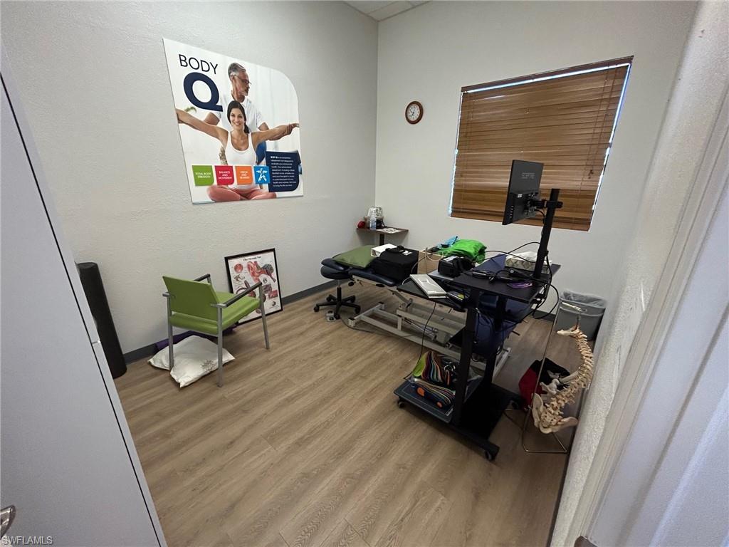 Office with light wood finished floors and baseboards