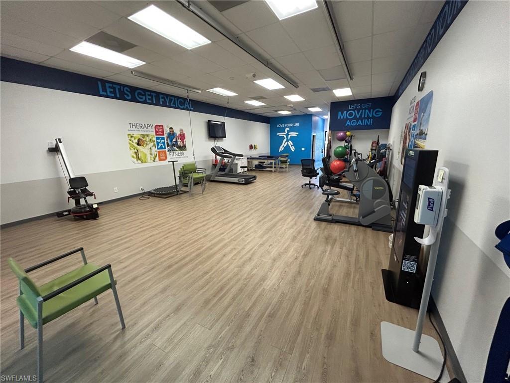 Exercise room featuring a drop ceiling