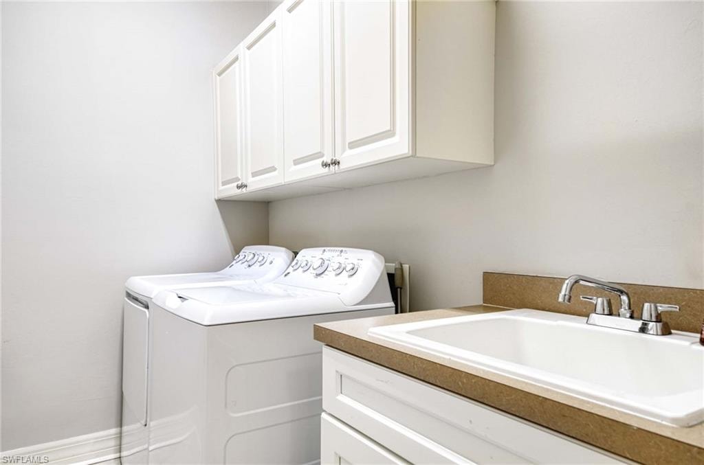 Washroom with independent washer and dryer and cabinet space
