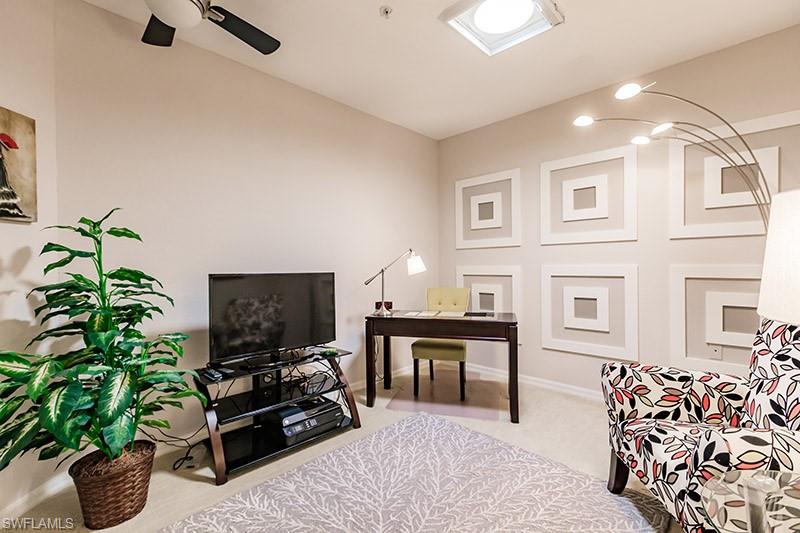 Office area featuring carpet and ceiling fan