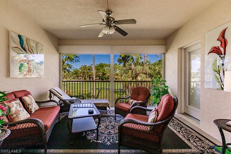 View of patio with outdoor lounge area and ceiling fan