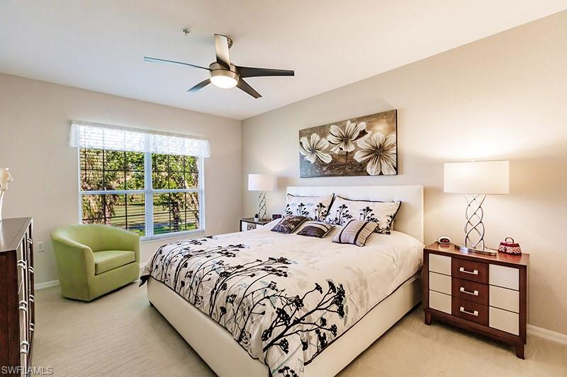 Bedroom with light carpet and ceiling fan