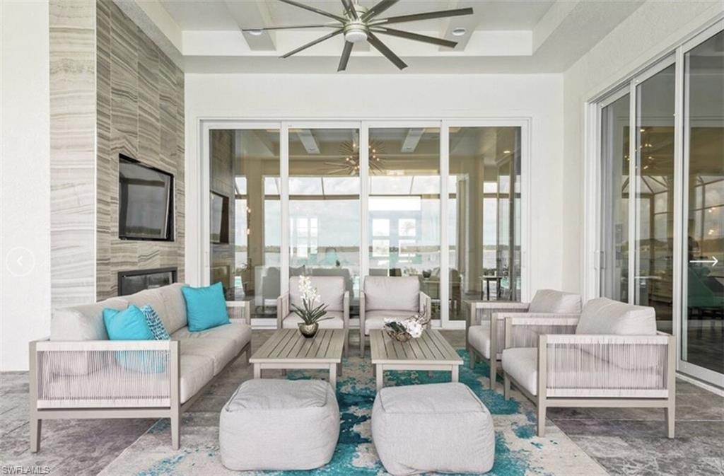 View of patio featuring a ceiling fan and an outdoor living space