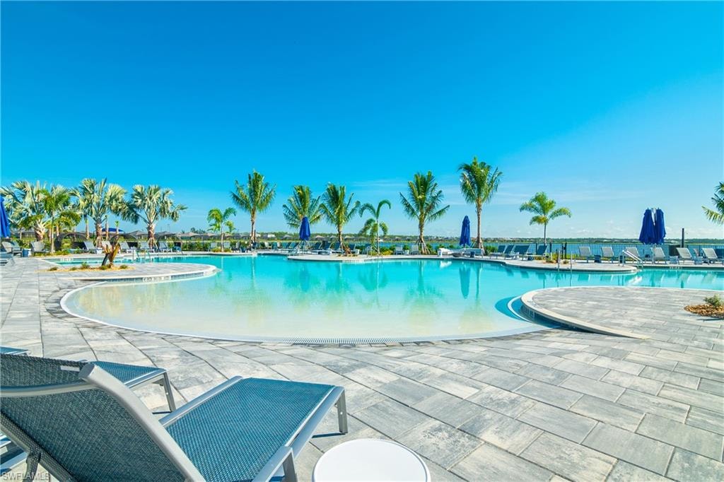 Community pool with a patio area