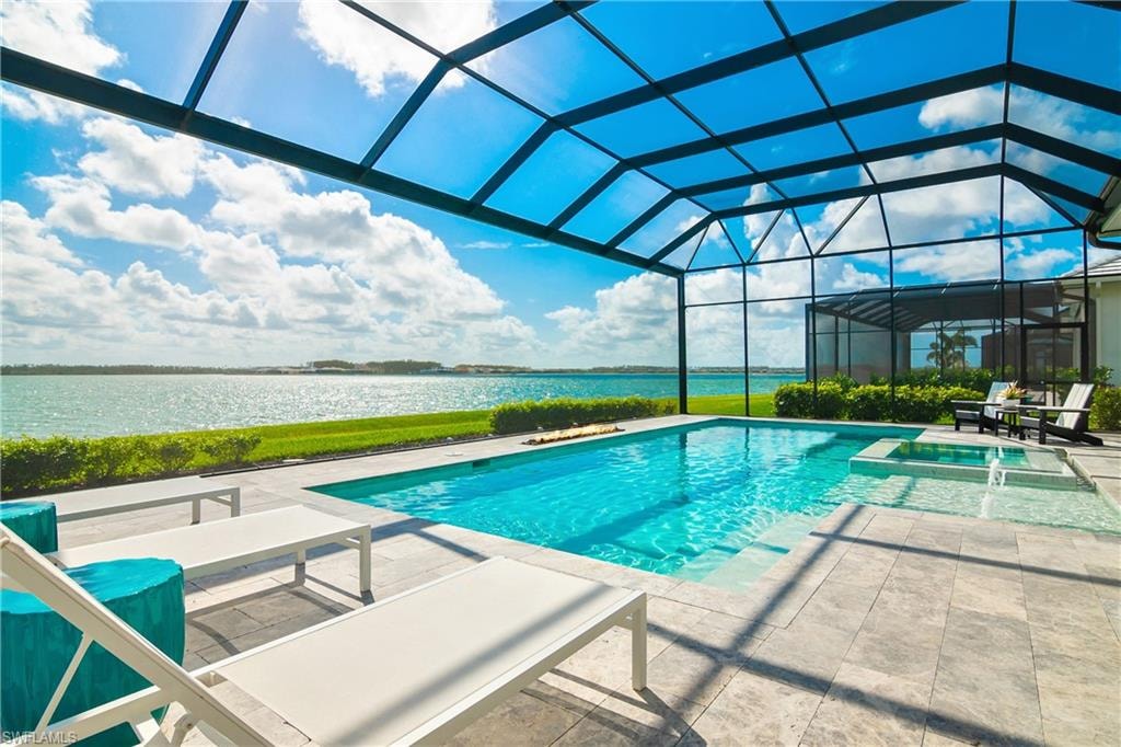 View of pool with a lanai, a water view, a patio, and a sunroom