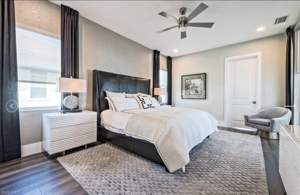 Bedroom with ceiling fan, dark wood finished floors, and recessed lighting